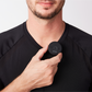 Compact wireless Bluetooth mic clipped onto a person's shirt.